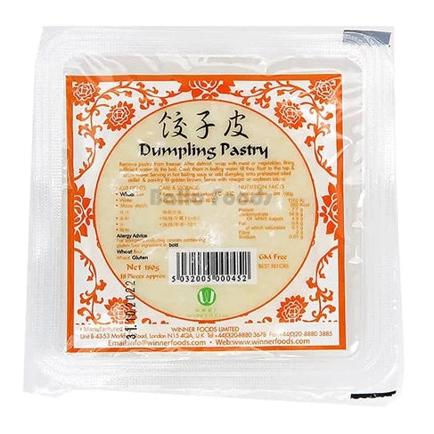 A packaged block of dumpling pastry (johszi pi) in a clear plastic bag with a prominent orange and beige label, shown against a plain white background.