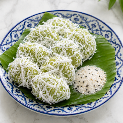 Green and white dessert on a decorative plate with a leaf