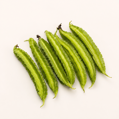 Six winged beans arranged diagonally on a plain off-white background.