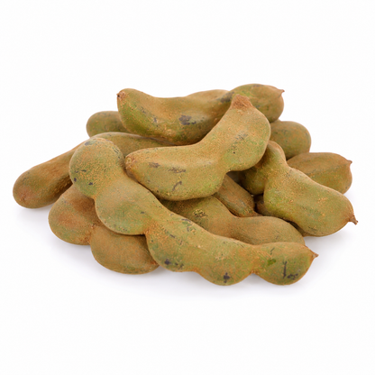 A pile of raw, uncooked tamarind pods with a textured, earthy green-brown skin, arranged on a clean white background.